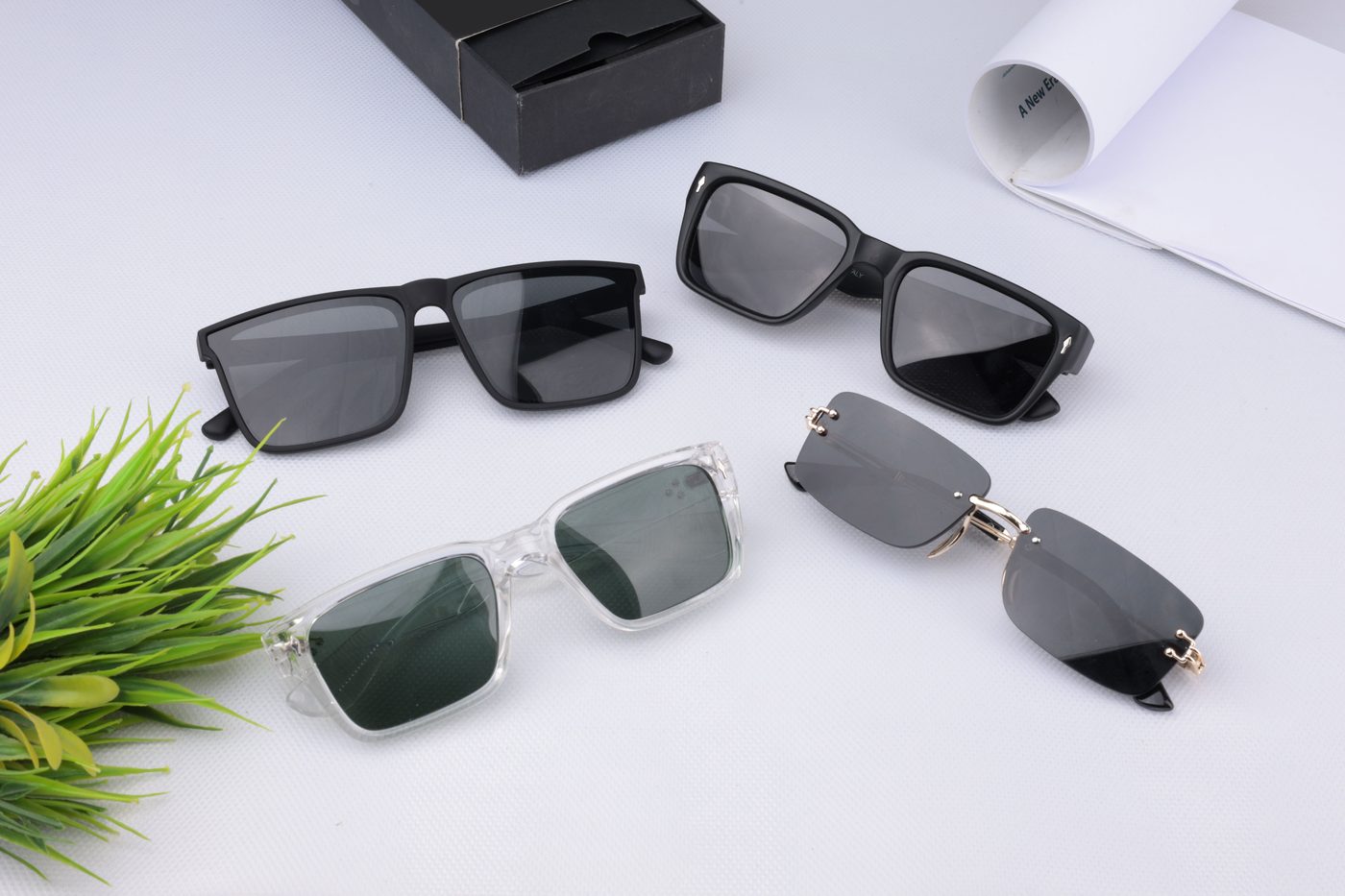 Four pairs of sunglasses laid out together